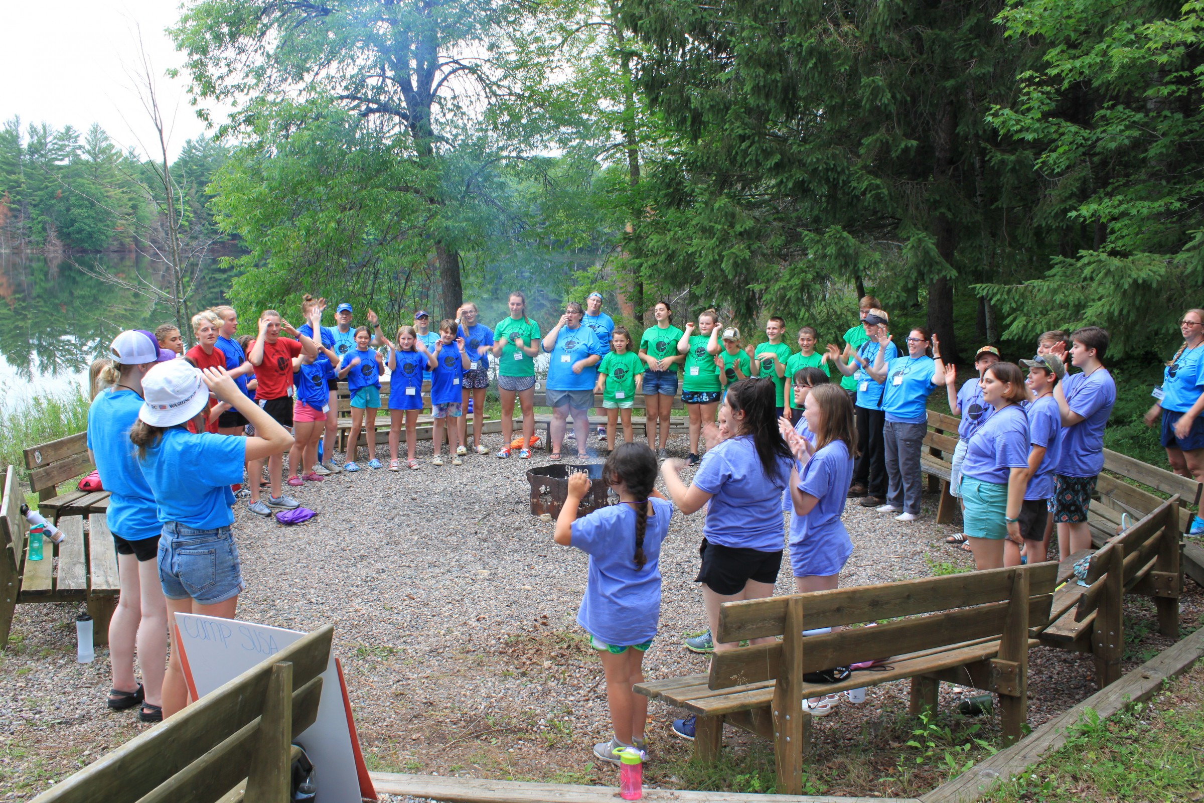 4Hers gathering around fire