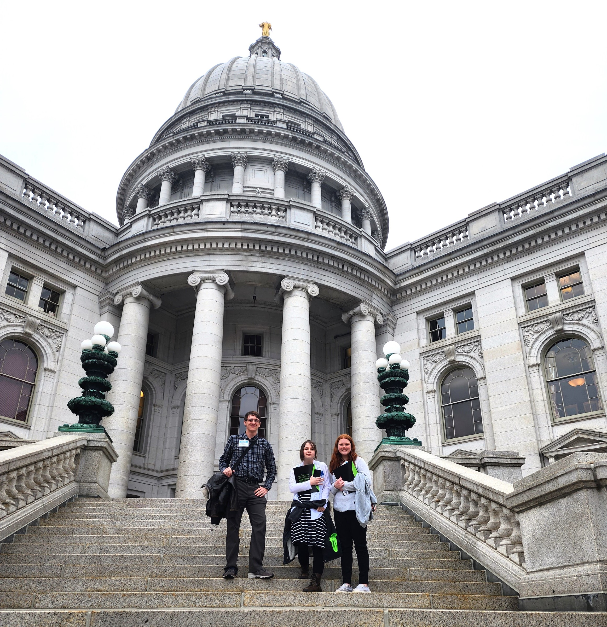 Teen Court panelist poses in front of courthouse.