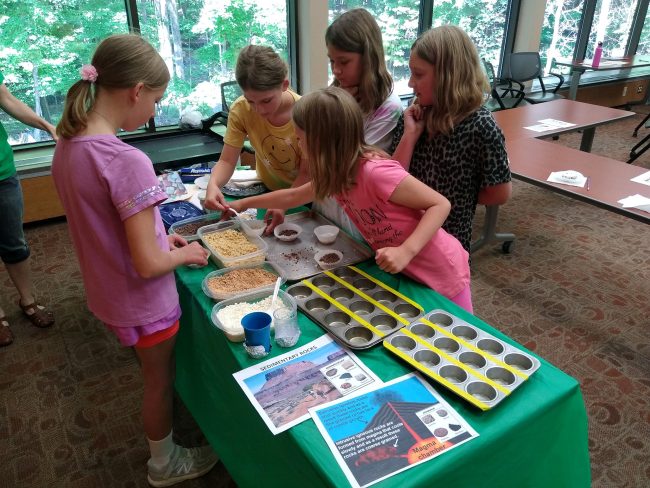 4Hers doing a science project with rocks.