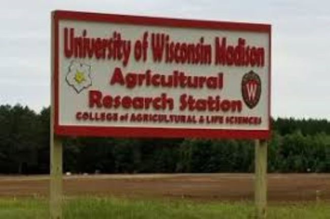 Photo of a sign stating University of Wisconsin Madison Agricultural Research Station College of Agricultural & Life Sciences.